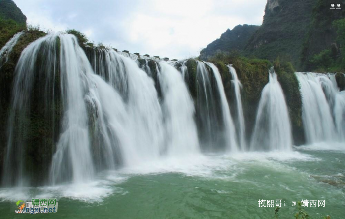 青峰断缺立野间，飞流直泻掩峭岩。水云雾烟难分辨，疑是仙女挂素. - 靖西网