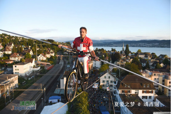 颠峰对决--重庆武隆天坑举行全球首例跑钢丝大赛[9P] - 靖西网